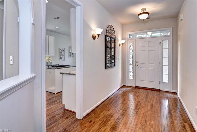 6667 Rexford Ln, Williamsburg, VA 23188 - foyer featuring light wood-type flooring and healthy amount of natural light