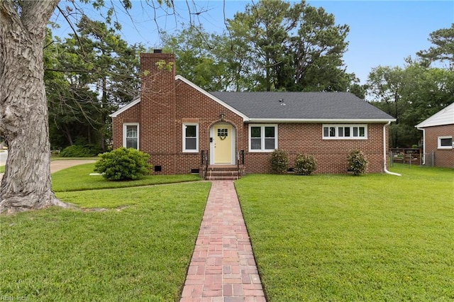 1 N Greenfield Ave, Hampton, VA 23666 - view of front of house featuring a chimney, a front lawn, and brick siding