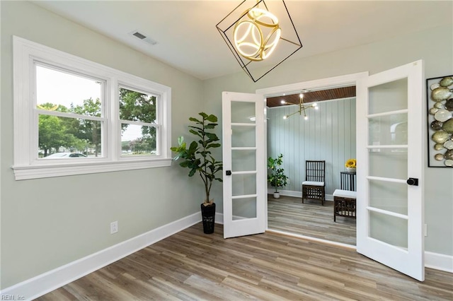 1 N Greenfield Ave, Hampton, VA 23666 - dining room featuring a chandelier, wood finished floors, and french doors