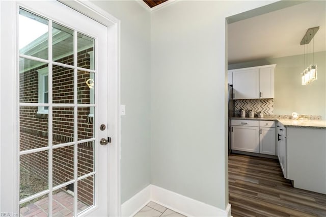 1 N Greenfield Ave, Hampton, VA 23666 - doorway to outside featuring baseboards and dark wood-type flooring