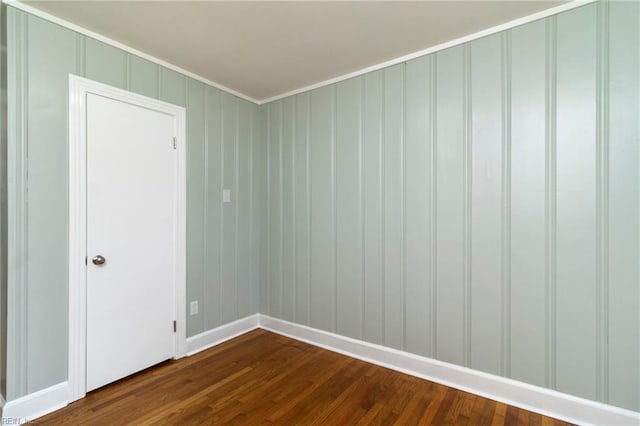 1 N Greenfield Ave, Hampton, VA 23666 - empty room featuring dark wood-type flooring, a decorative wall, and crown molding