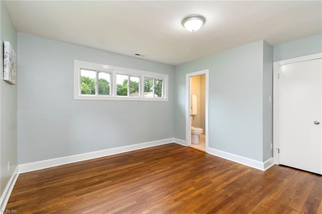1 N Greenfield Ave, Hampton, VA 23666 - unfurnished bedroom with wood finished floors and ensuite bathroom