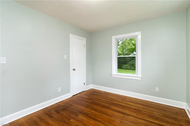 1 N Greenfield Ave, Hampton, VA 23666 - unfurnished room featuring baseboards and dark wood-style flooring