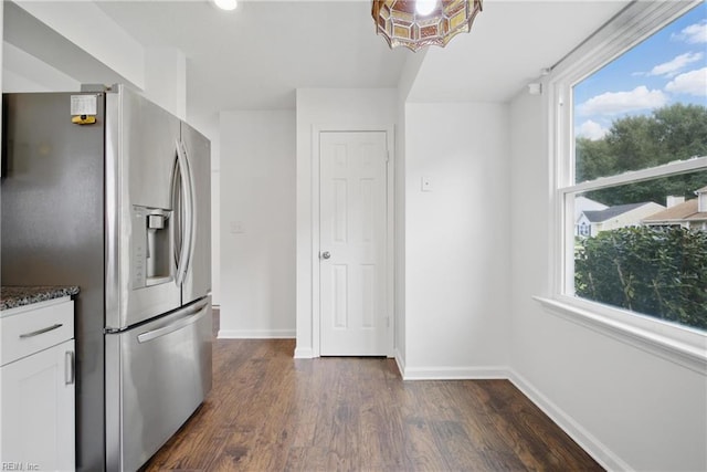 1445 Debbs Ln, Chesapeake, VA 23320 - kitchen with stainless steel fridge with ice dispenser, plenty of natural light, dark wood-type flooring, and white cabinetry