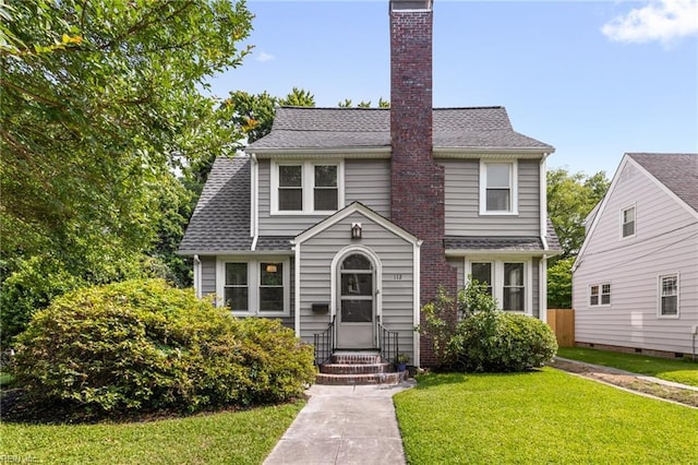 112 Fayton Ave, Norfolk, VA 23505 - view of front facade featuring a front lawn, a chimney, and roof with shingles