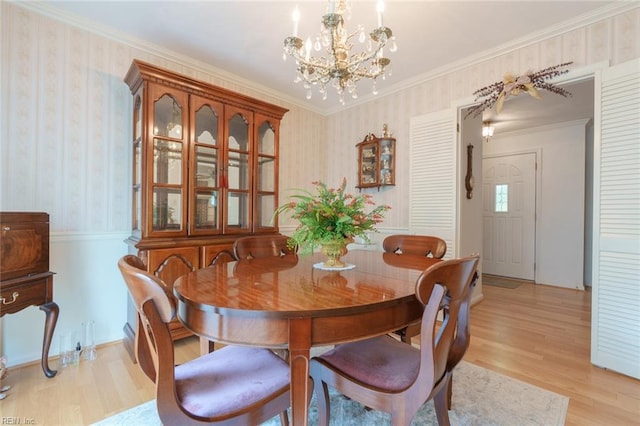 1328 Burlington Rd, Virginia Beach, VA 23464 - dining room featuring wallpapered walls, a chandelier, light wood-style flooring, and ornamental molding