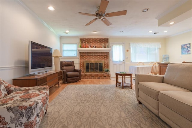1328 Burlington Rd, Virginia Beach, VA 23464 - living area with a ceiling fan, crown molding, light wood-type flooring, recessed lighting, and a brick fireplace