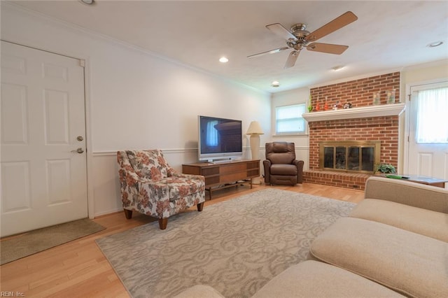 1328 Burlington Rd, Virginia Beach, VA 23464 - living room with crown molding, wood finished floors, a ceiling fan, a brick fireplace, and recessed lighting