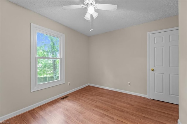 890 Brompton Ct, Newport News, VA 23608 - spare room with light wood finished floors, a textured ceiling, and a ceiling fan