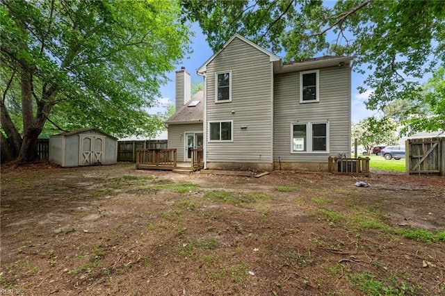 890 Brompton Ct, Newport News, VA 23608 - rear view of property featuring a deck, a storage shed, and a chimney