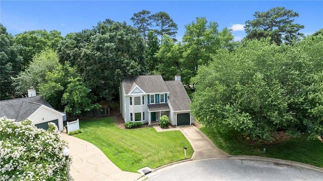 890 Brompton Ct, Newport News, VA 23608 - view of front facade featuring concrete driveway, an attached garage, a front yard, and a chimney