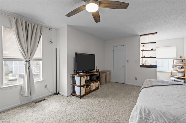 4592 Genoa Cir, Virginia Beach, VA 23462 - bedroom featuring multiple windows, a textured ceiling, ceiling fan, and light carpet