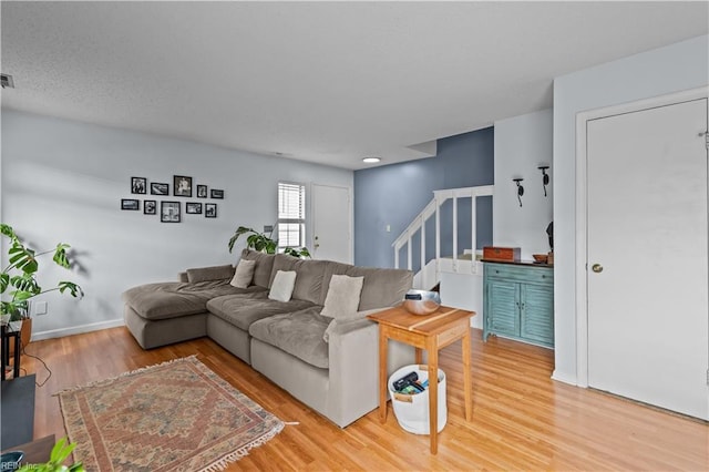 4592 Genoa Cir, Virginia Beach, VA 23462 - living room with stairway and light wood-style floors