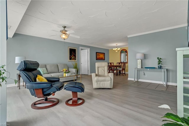 4004 Atlantic Ave Unit 309, Virginia Beach, VA 23451 - living area featuring wood finished floors, a chandelier, ceiling fan, and crown molding