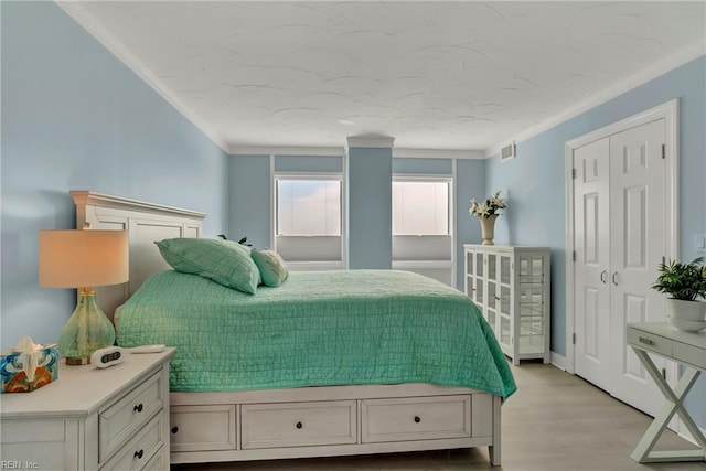 4004 Atlantic Ave Unit 309, Virginia Beach, VA 23451 - bedroom featuring ornamental molding and light wood-type flooring