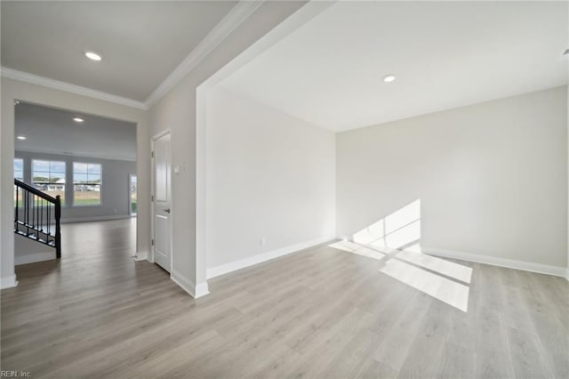 1239 Kidbrooke St, Chesapeake, VA 23322 - empty room featuring wood finished floors, crown molding, recessed lighting, and stairway