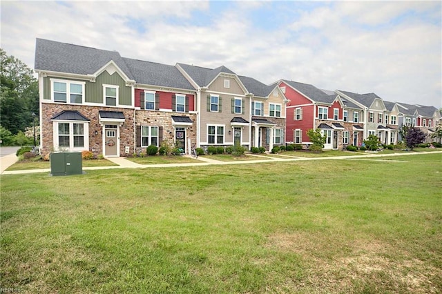 4321 Sconce, Williamsburg, VA 23188 - townhome / multi-family property with stone siding, a residential view, a front lawn, and board and batten siding