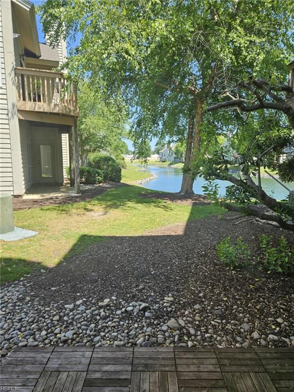 495 E Lake Cir, Chesapeake, VA 23322 - view of grassy yard with a water view and a balcony
