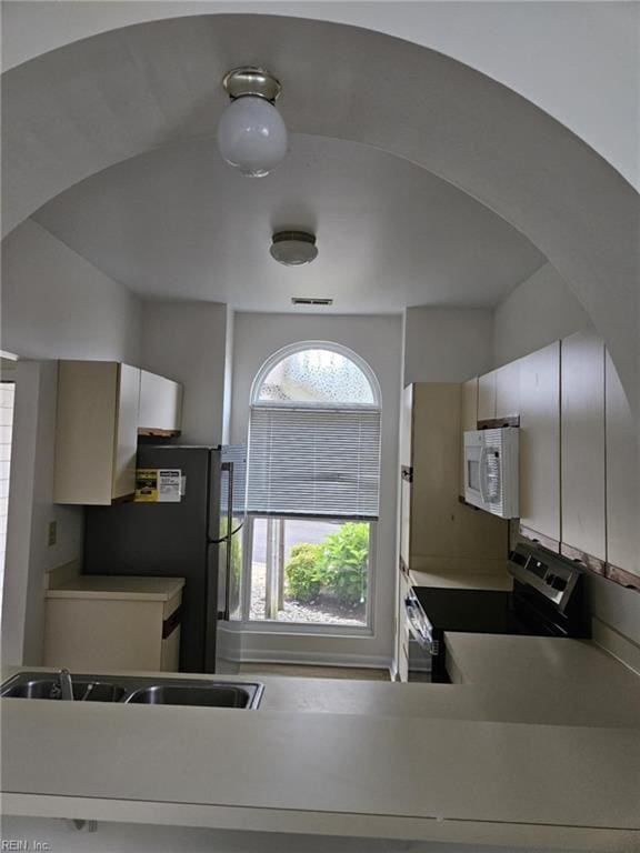 495 E Lake Cir, Chesapeake, VA 23322 - kitchen with stainless steel appliances and arched walkways