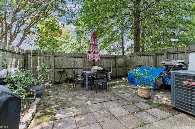 19 Dawn Ln, Hampton, VA 23666 - fenced backyard featuring outdoor dining space, a patio, and a grill