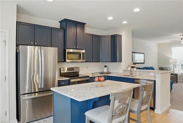 3102 Rollie Way, Chesapeake, VA 23323 - kitchen with appliances with stainless steel finishes, open floor plan, a peninsula, light stone countertops, and recessed lighting