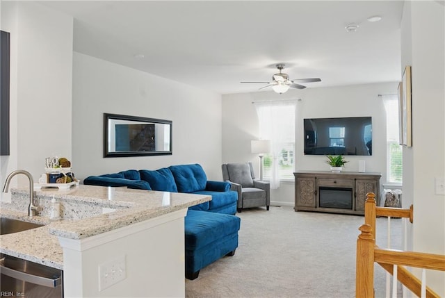 3102 Rollie Way, Chesapeake, VA 23323 - living area featuring light carpet, a ceiling fan, and a glass covered fireplace