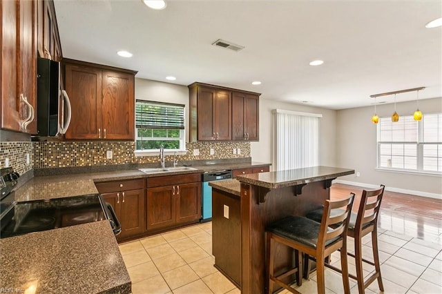 305 Roane Dr, Hampton, VA 23669 - kitchen with dishwashing machine, stainless steel microwave, light tile patterned floors, black electric range, and tasteful backsplash