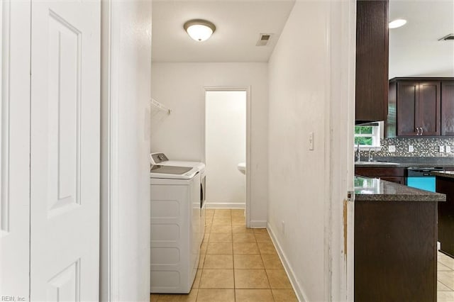 305 Roane Dr, Hampton, VA 23669 - laundry area with washer and clothes dryer and light tile patterned flooring