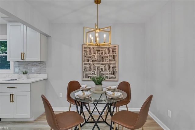 1226 Penniman Rd, Williamsburg, VA 23185 - dining area featuring a chandelier and light wood-style floors