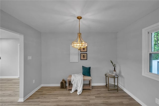 1226 Penniman Rd, Williamsburg, VA 23185 - sitting room with wood finished floors and a chandelier