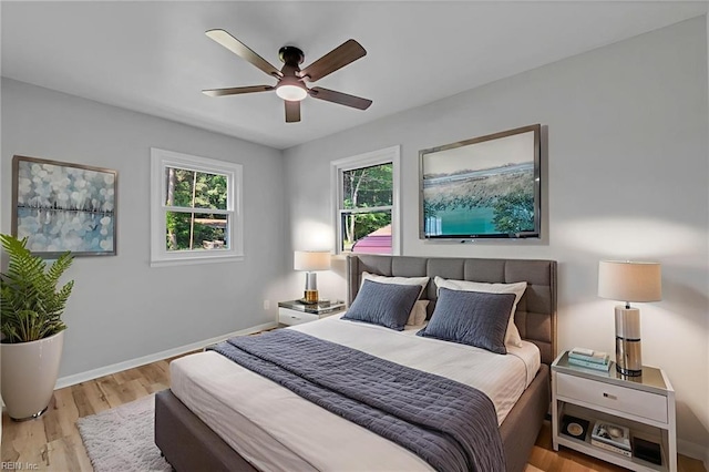 1226 Penniman Rd, Williamsburg, VA 23185 - bedroom with multiple windows, wood finished floors, and ceiling fan