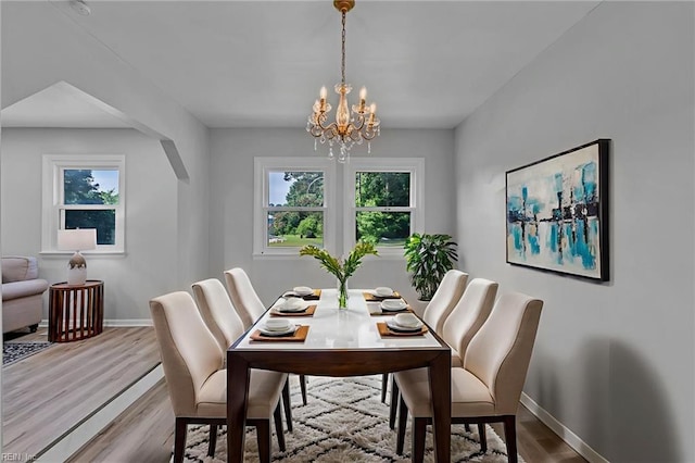1226 Penniman Rd, Williamsburg, VA 23185 - dining area featuring a chandelier and wood finished floors