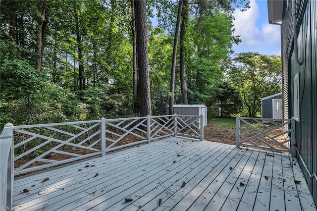 1226 Penniman Rd, Williamsburg, VA 23185 - wooden deck featuring view of wooded area and a storage shed