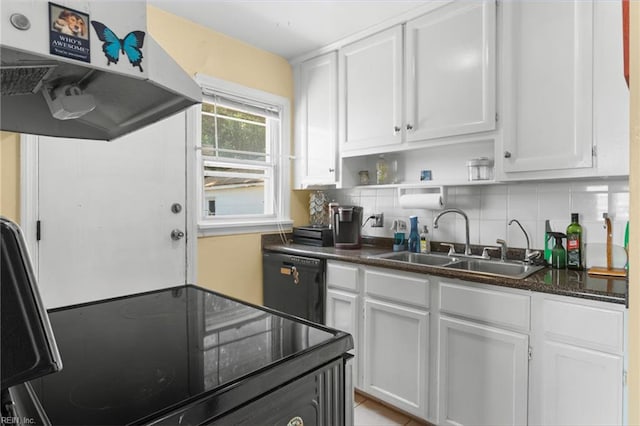 8048 Tidewater Dr, Norfolk, VA 23505 - kitchen with under cabinet range hood, black dishwasher, white cabinets, tasteful backsplash, and dark stone countertops