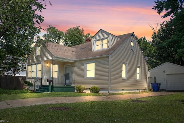 8048 Tidewater Dr, Norfolk, VA 23505 - view of front of house featuring an outdoor structure, driveway, a chimney, a detached garage, and roof with shingles