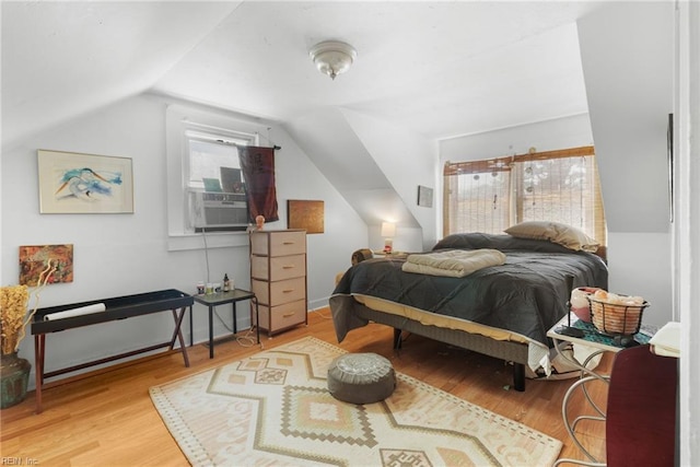 8048 Tidewater Dr, Norfolk, VA 23505 - bedroom with vaulted ceiling, wood finished floors, and cooling unit