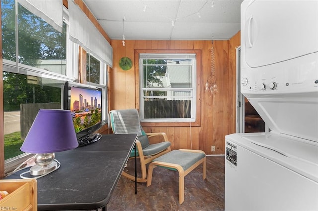 8048 Tidewater Dr, Norfolk, VA 23505 - laundry area with stacked washer / drying machine and wood walls