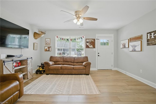 116 B St, Moyock, NC 27958 - living area with ceiling fan and light wood-style flooring