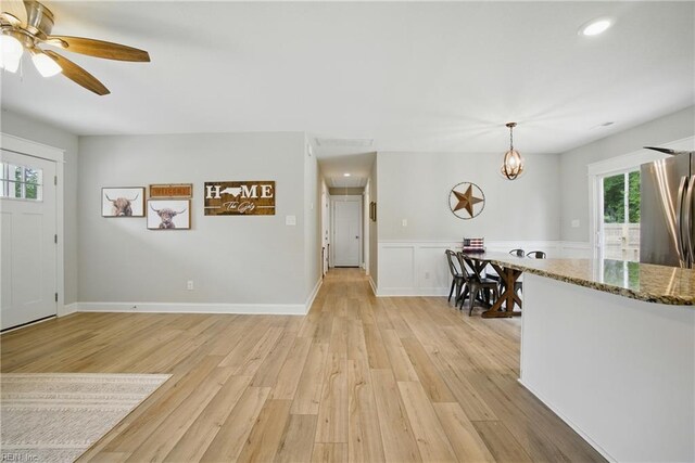 116 B St, Moyock, NC 27958 - entrance foyer featuring light wood-style flooring, ceiling fan, recessed lighting, a wainscoted wall, and a chandelier