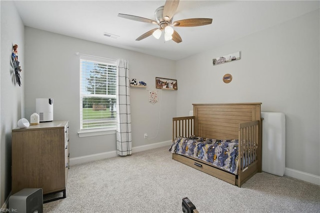116 B St, Moyock, NC 27958 - carpeted bedroom with baseboards and a ceiling fan