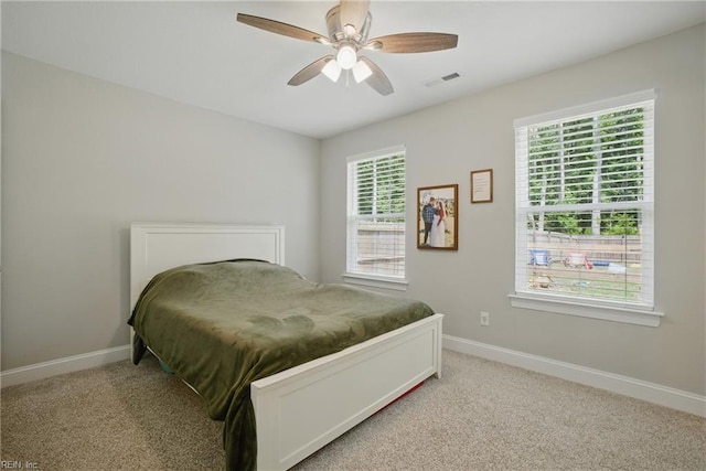 116 B St, Moyock, NC 27958 - bedroom featuring light carpet and a ceiling fan