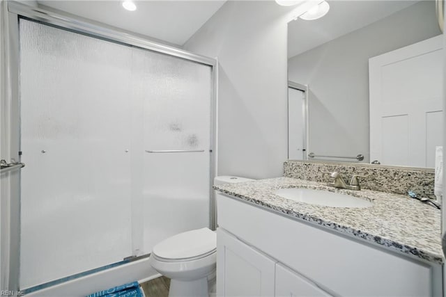 116 B St, Moyock, NC 27958 - full bath featuring a stall shower, vanity, and wood finished floors
