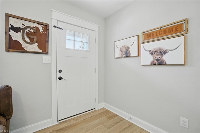 116 B St, Moyock, NC 27958 - foyer with light wood-style flooring and baseboards