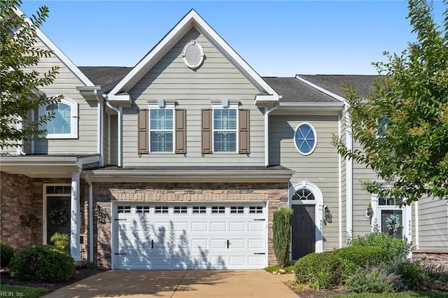 4048 Coronation, Williamsburg, VA 23188 - view of front facade featuring a garage, driveway, and a shingled roof