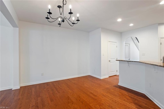 4048 Coronation, Williamsburg, VA 23188 - unfurnished dining area featuring a chandelier, wood finished floors, recessed lighting, and arched walkways