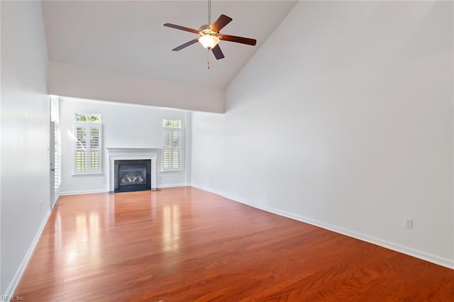 4048 Coronation, Williamsburg, VA 23188 - unfurnished living room featuring high vaulted ceiling, ceiling fan, wood finished floors, and a fireplace with flush hearth