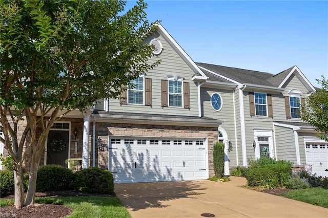 4048 Coronation, Williamsburg, VA 23188 - view of front of property featuring an attached garage, driveway, and stone siding