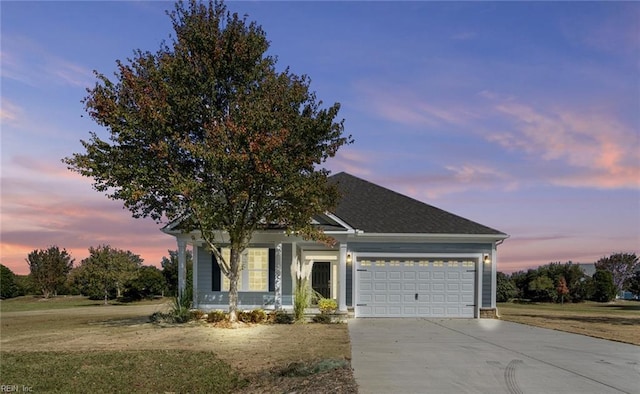 156 Quarter Horse Loop, Hertford, NC 27944 - view of front of house featuring concrete driveway, an attached garage, a porch, and a lawn