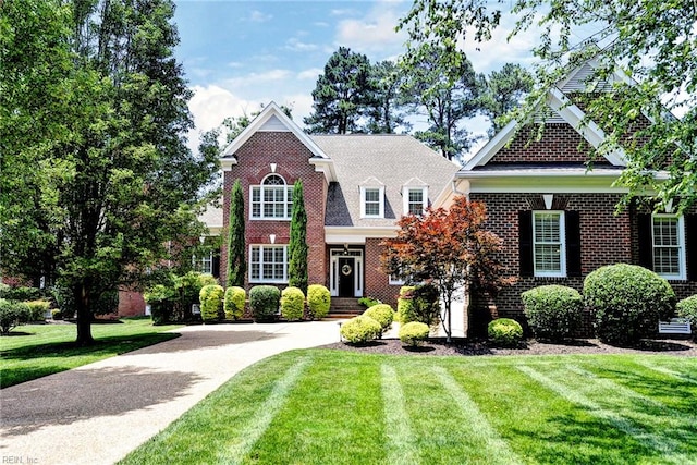 1808 John Hancock Rd, Williamsburg, VA 23185 - view of front of home featuring a front lawn and brick siding