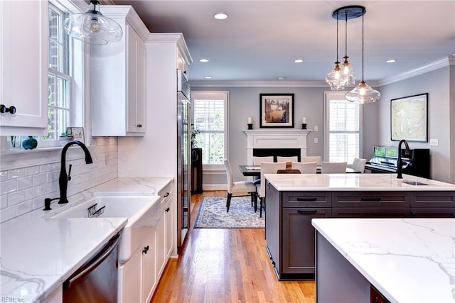 1808 John Hancock Rd, Williamsburg, VA 23185 - kitchen featuring stainless steel appliances, white cabinets, plenty of natural light, ornamental molding, and recessed lighting